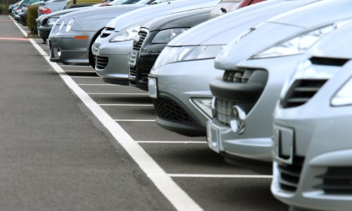 Row of cars in parking spots