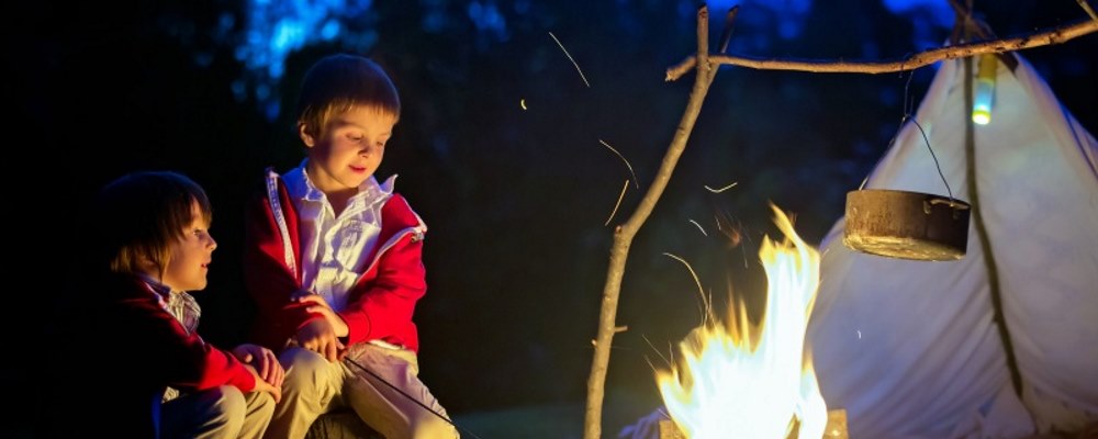 children by a campfire