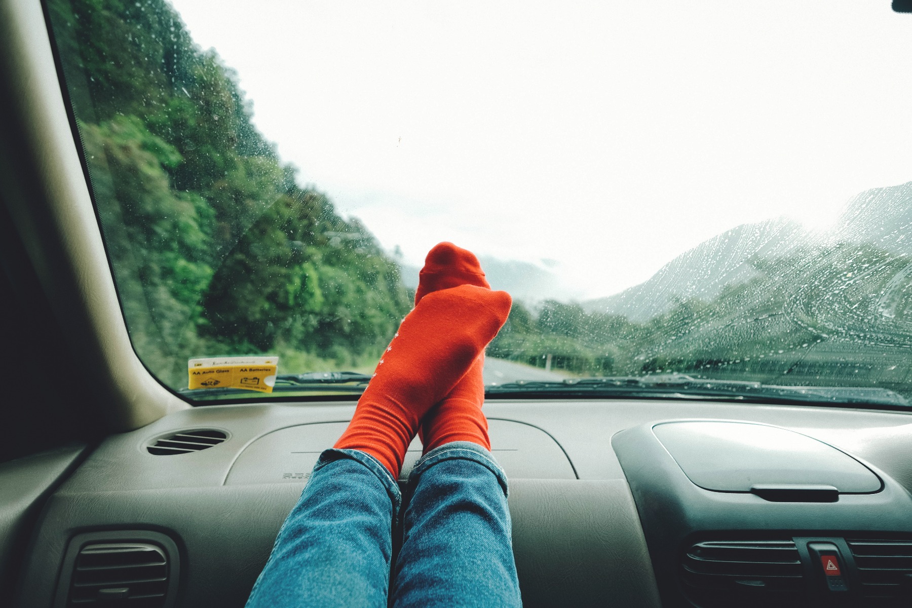 Feet up on dashboard whilst on long road trip Putting the feet on the dashboard whilst on a road trip